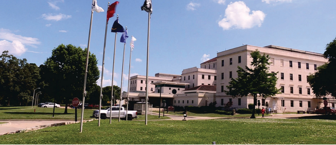 Alexandria VA Healthcare System exterior shot of lawn and flag poles.